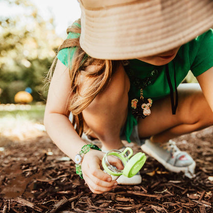 Jungle Gems necklace girl squatting